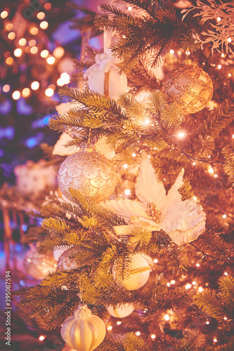 Colorful christmas ornaments and decorations hanging from christmas tree