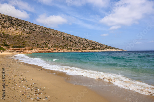Fototapeta Naklejka Na Ścianę i Meble -  Agia Theodoti beach on Ios Island. A wonderful beach with the golden sand and azure waters. Cyclades, Greece