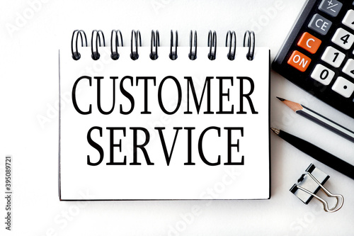 CUSTOMER SERVICE, text on white paper on a light, white background