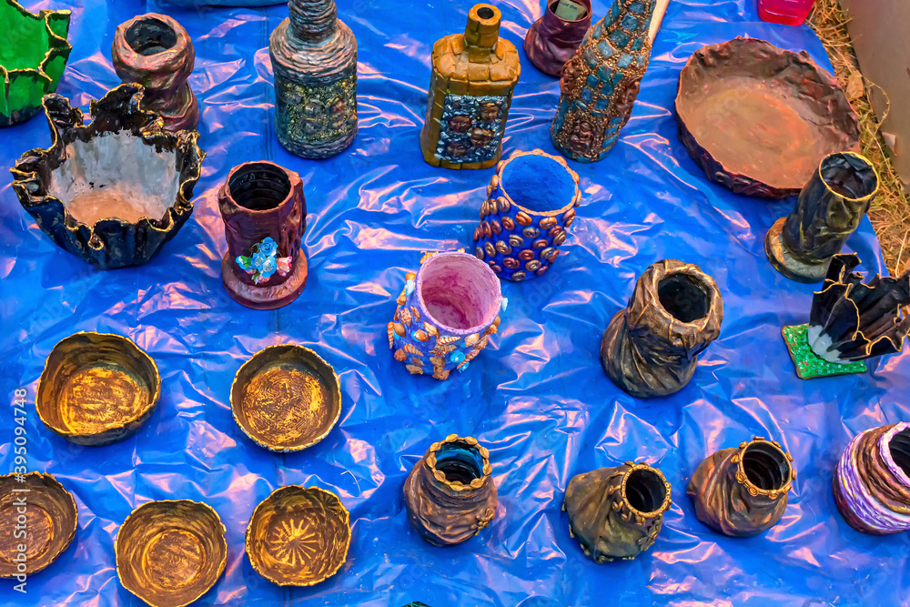 Fototapeta premium Vase, pen stand and bowl are made from waste component, displayed for sale.