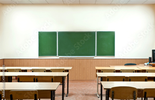  class room with a school board and school desks