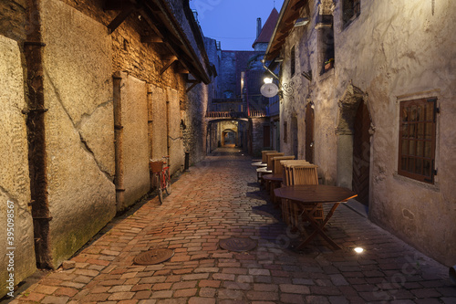 Medieval street in old town, Katarina Passage, Tallinn, Estonia. Illuminated at evening