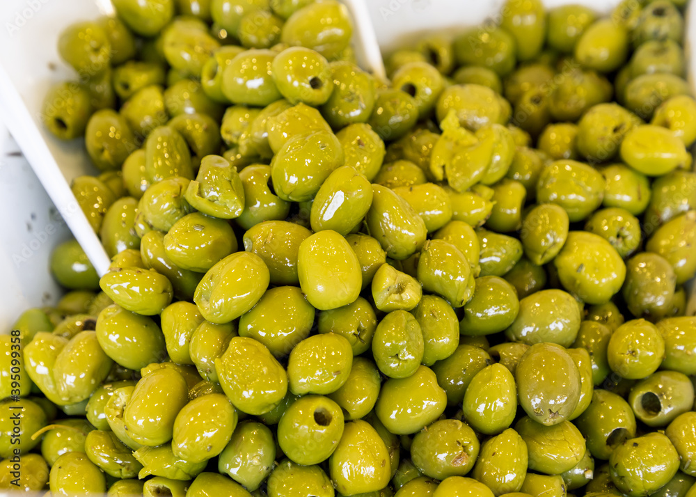 Green salted olives on the market (Selective focus) Green salted olives on the market (Selective focus)