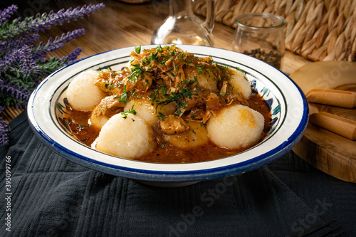 Dumplings with turkey and chorizo sauce. photo