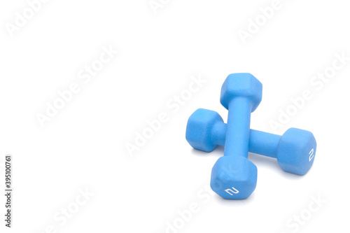 Blue dumbbells on white with copy space
