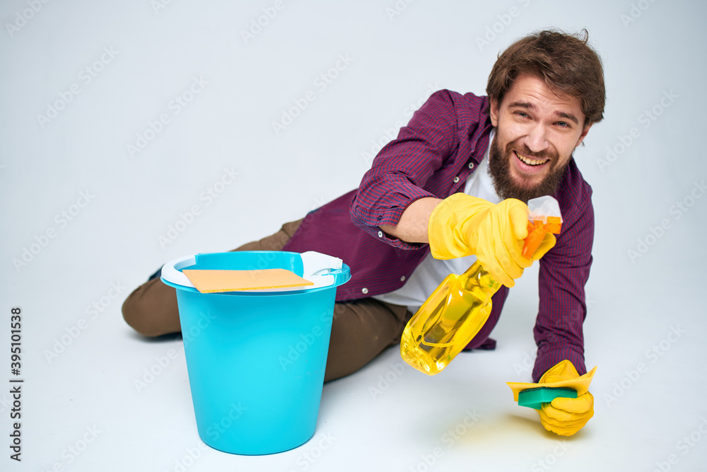 Cleaner with a bucket on the floor professional detergent service Cleaner with a bucket on the floor professional detergent service