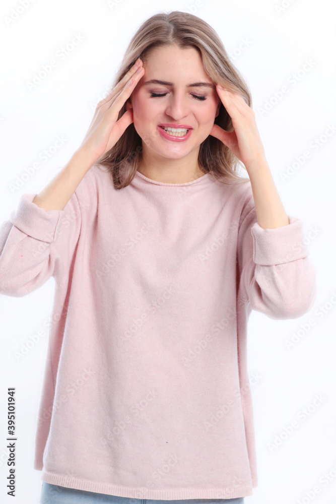 Young caucasian woman suffers from headache Young caucasian woman suffers from headache