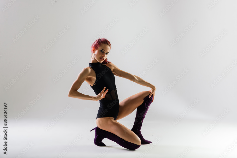 Sexy pole redhead dancer showing her body. Sexy pole redhead dancer showing her body.