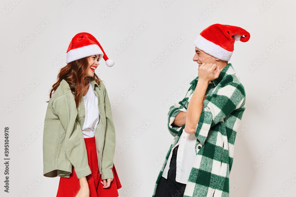 woman standing next to christmas hats communication new year holiday relationship