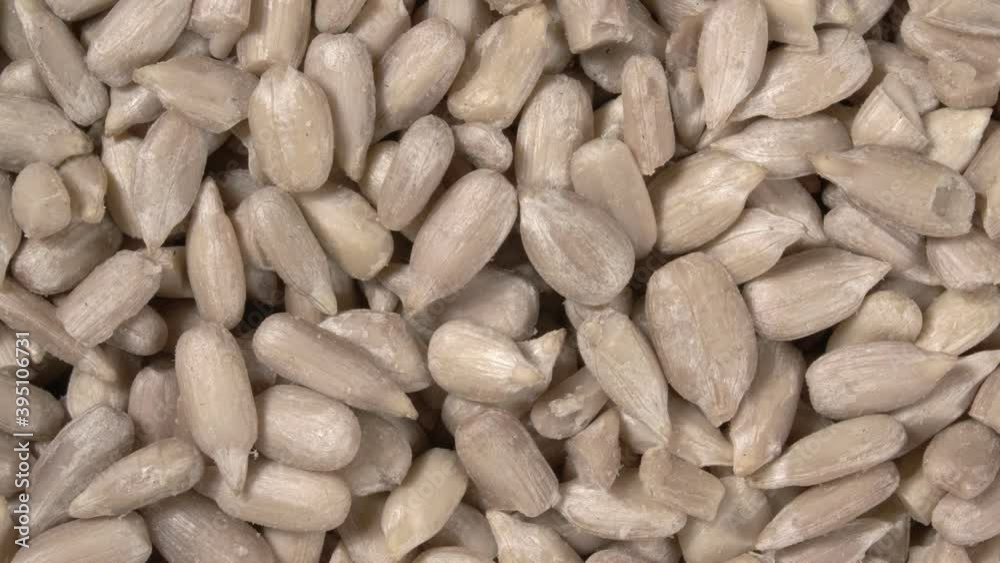 Rotation of peeled sunflower seeds close-up. 4K video. Super macro. Rotation of peeled sunflower seeds close-up. 4K video. Super macro.