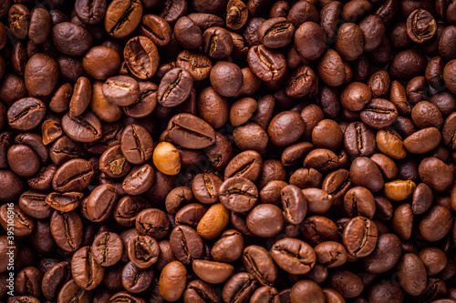 aromatic fresh coffee beans on a white wooden rustic background