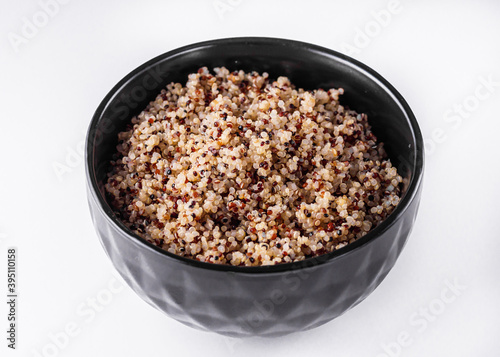 bowl of healthy quinoa on a white acrylic background