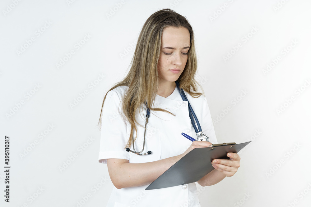 Medicine and health concept. The doctor writes the information into the tablet. Medicine and health concept. The doctor writes the information into the tablet.