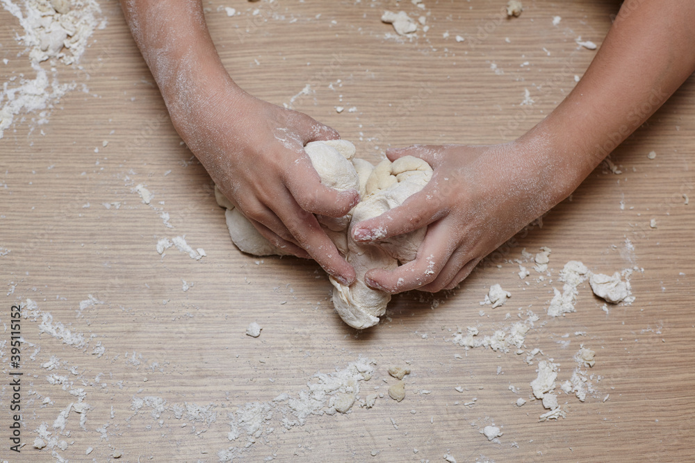 Fototapeta premium Kid you are playing and making dough.