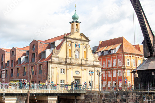 Panorama at the old market  Stintmarkt  old wooden crane and old department store Luneburg  in german L  neburg  Lower Saxony  in german Niedersachsen  Germany