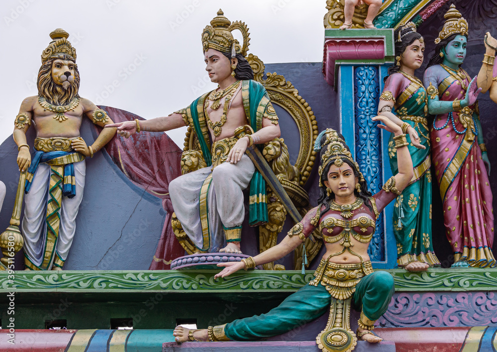 Kadirampura, Karnataka, India - November 4, 2013: Sri Murugan Temple. Colorful statues, closeup of emissionary lecturing Surapadman wirh brother Singamukhan behind him