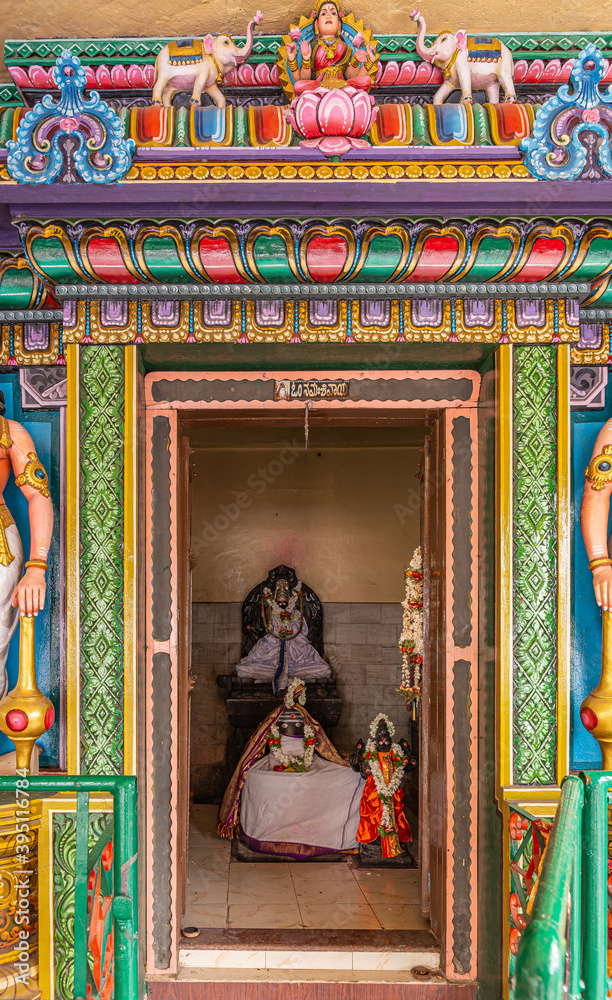 Kadirampura, Karnataka, India - November 4, 2013: Sri Murugan Temple. Niche shrine with colorful decorations with statue of Goddess Lakshmi.