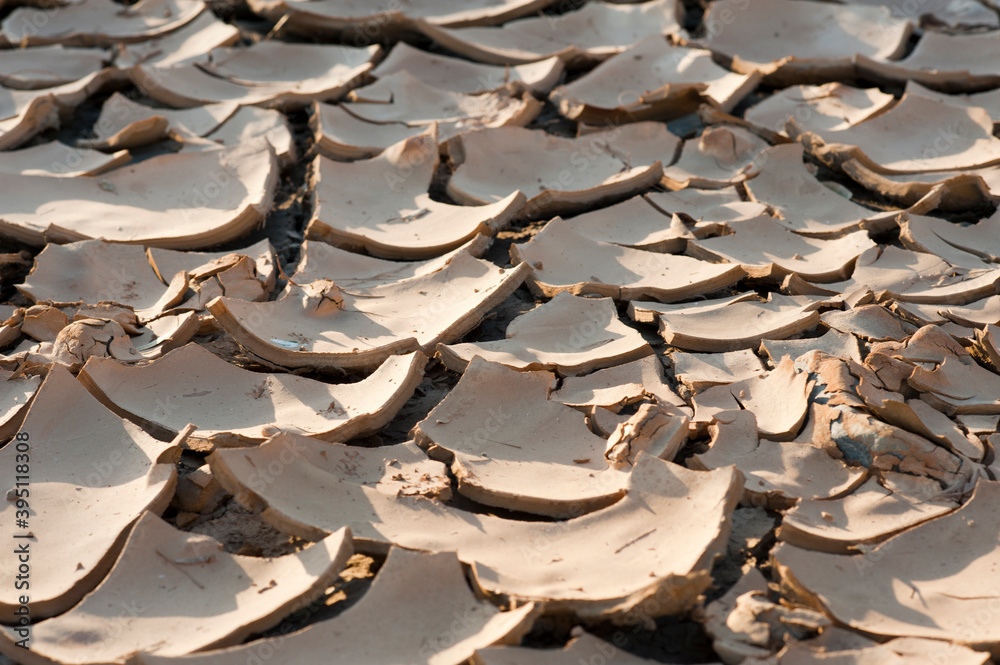 Apocalyptic landscape with earth broken into fantastic geometric shapes. The table shows the arid and dry climate of the summer. Apocalyptic landscape with earth broken into fantastic geometric shapes. The table shows the arid and dry climate of the summer.