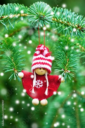 Christmas fir tree branch background with decorative toy