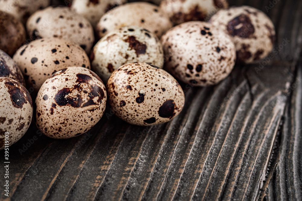 fresh quail eggs on a dark wooden rustic background fresh quail eggs on a dark wooden rustic background