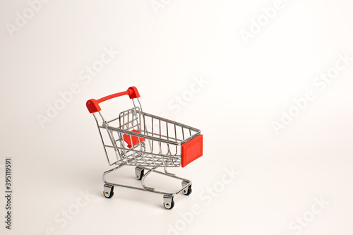 Shopping toy cart isolated on white background