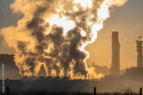 Factory smoke chimney piping smoke or steam into the air pollution © attraction art