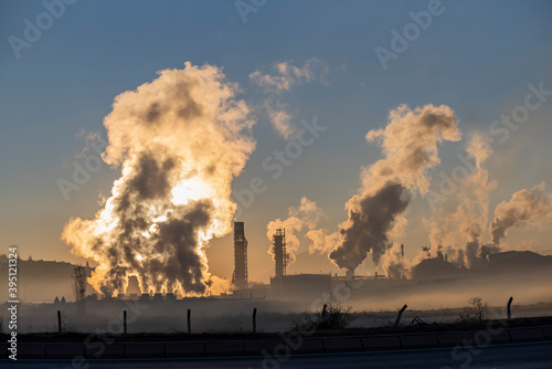 Factory smoke chimney piping smoke or steam into the air pollution © attraction art