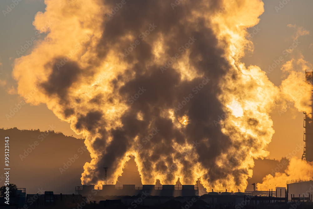 Factory smoke chimney piping smoke or steam into the air pollution