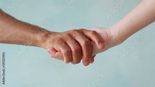 White and black hand connect. Anti-racism. Stop racism, all people are equal. Friendship of Peoples. Black lives matter