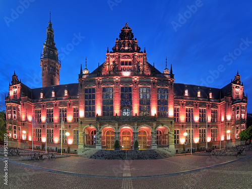 Academiegebouw (Main building) of the University of Groningen at evening, Netherlands. Panoramic view of facade.