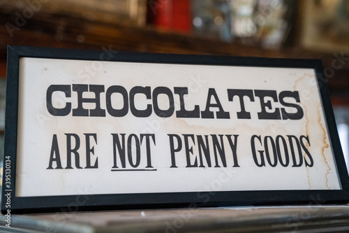 Chocolates are not penny goods sign, warning penny candy shop customers of policies