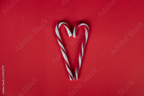 New Year's sweet decor on a red background. Christmas, holiday, give, count days, frame. flatlay. photo