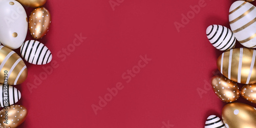 Banner with golden and white easter eggs painted with stripes and dots at sides of dark red background with empty copy space