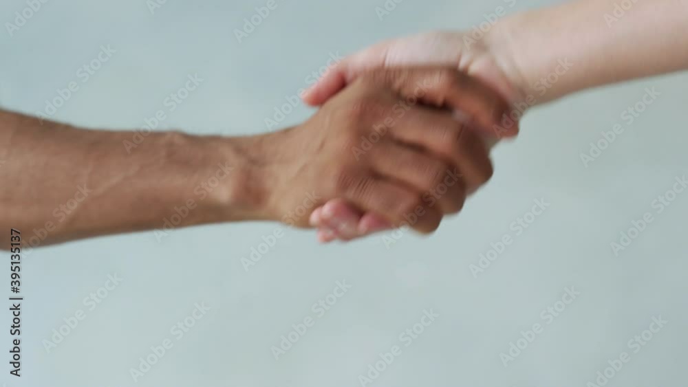 White and black hand connect. Anti-racism. Stop racism, all people are equal. Friendship of Peoples. Black lives matter White and black hand connect. Anti-racism. Stop racism, all people are equal. Friendship of Peoples. Black lives matter