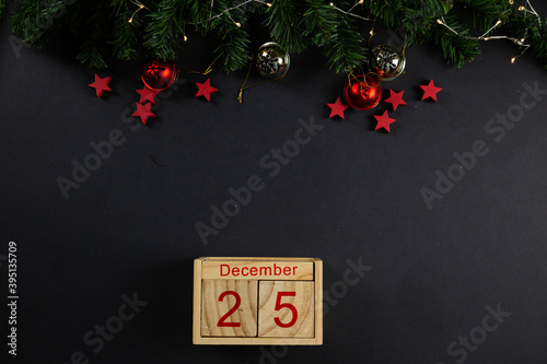 Christmas background Layflat. Red stars on black background, christmas decor, flatlay. Place for text, snow