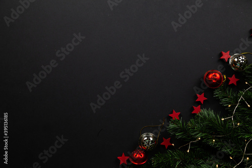 Christmas background Layflat. Red stars on black background, christmas decor, flatlay. Place for text, snow