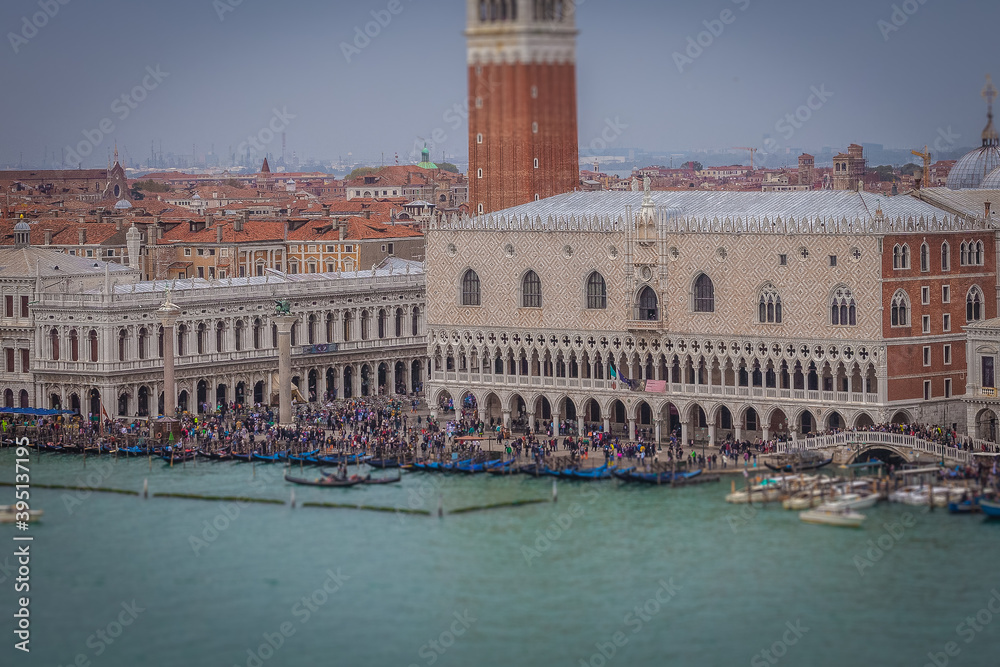 Tilt shift effect of Doge's Palace with hundreds of tourists , Venice, Italy