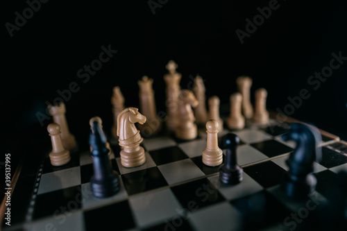 Chess pieces on a chessboard in a dark style