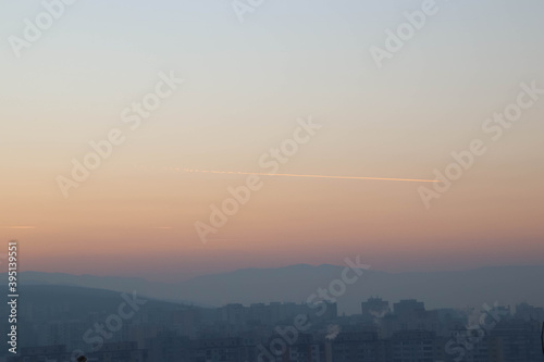 Neighborhood, mountains and sky and trace of plane © KVenus