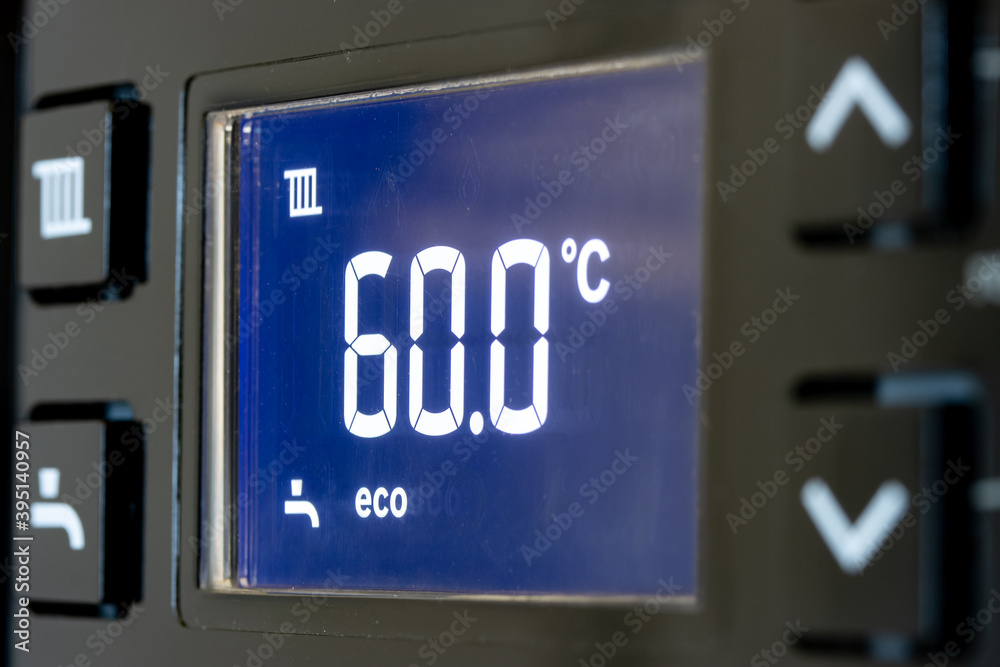 Control panel with display of the working gas boiler for hot water and heating. The smart control panel household gas boiler, close up. Control panel with display of the working gas boiler for hot water and heating. The smart control panel household gas boiler, close up.