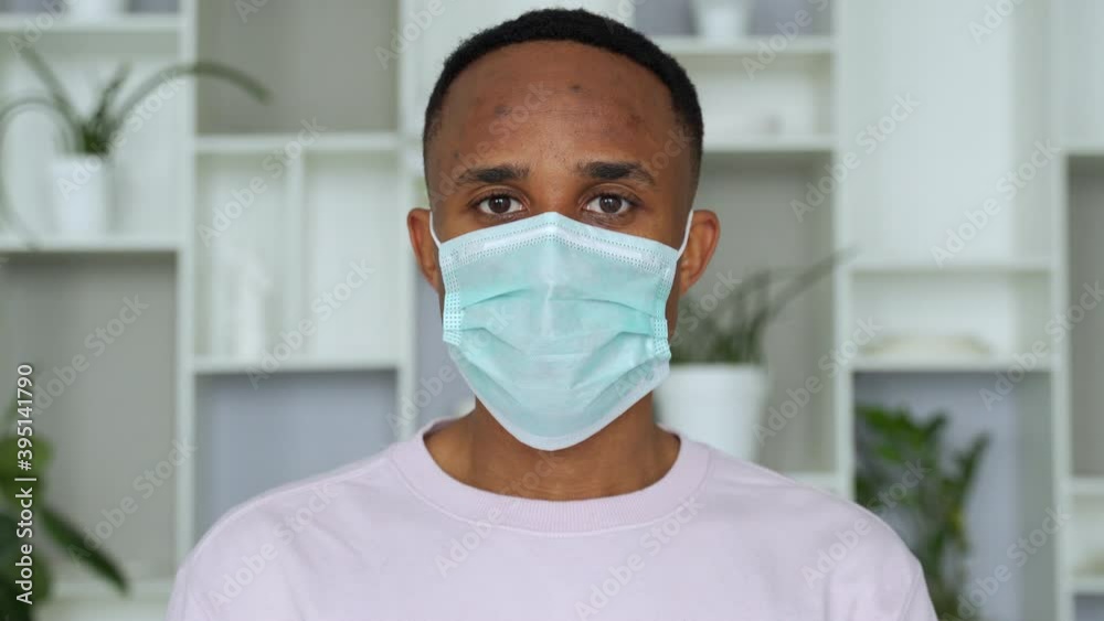 Young handsome african man wore face mask preventing, prevented himself from the outbreak in his society. Young handsome african man wore face mask preventing, prevented himself from the outbreak in his society.