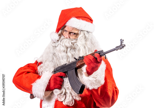Santa Claus is armed with a submachine gun, isolated on a white background.