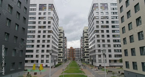 Aerial view of modern residential area of city with walking people