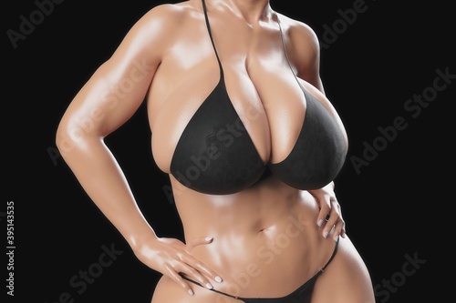 Sexy young woman with big boobs in a black bikini