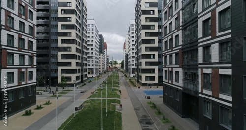 Aerial view of modern residential area of city with walking people