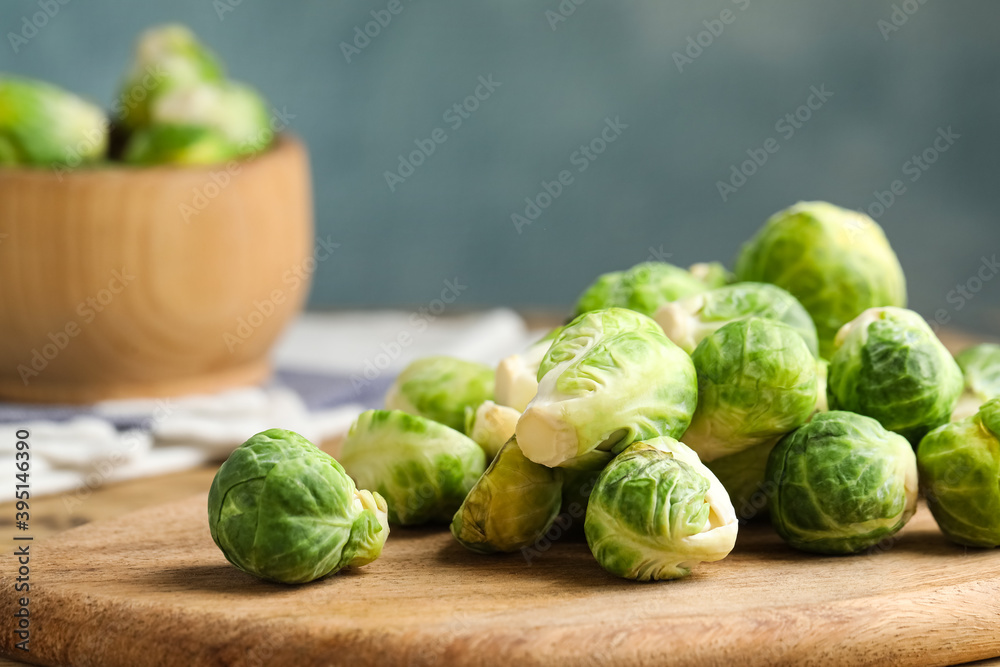 Fresh Brussels sprouts on wooden board, closeup Fresh Brussels sprouts on wooden board, closeup
