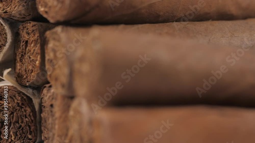 handrolled cuban cigars on white background 4k photo