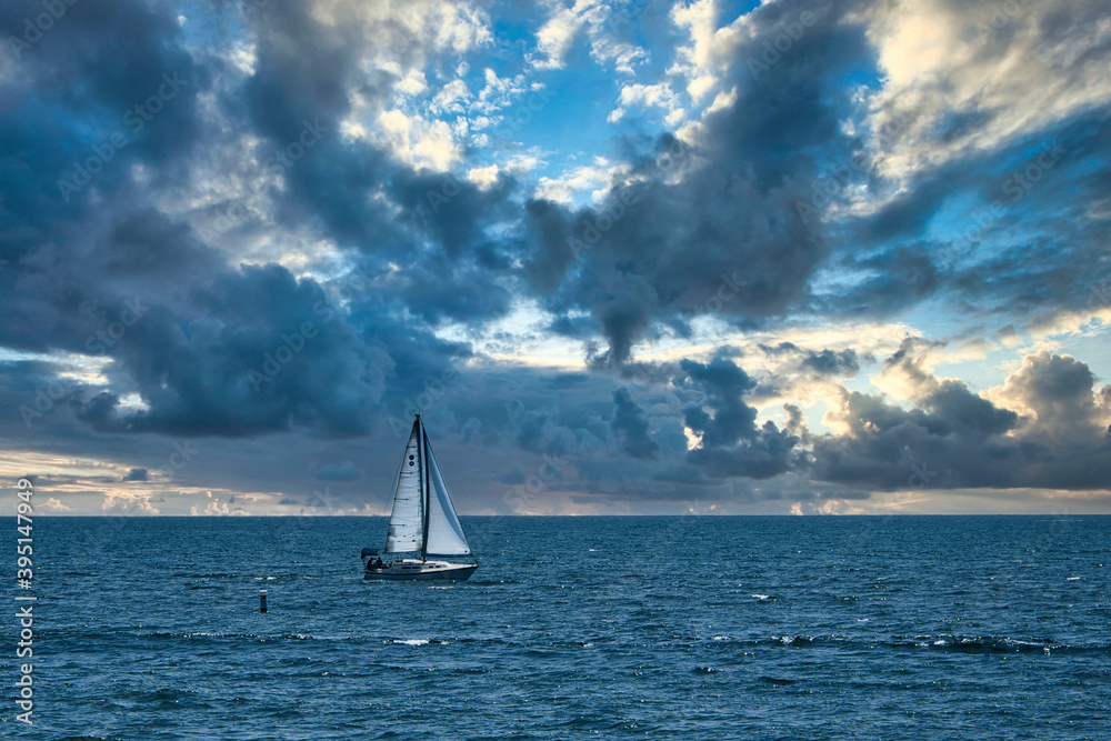 2020-11-24 A SAIL BOAT ON THE PACIFIC OCEAN WITH A CLOUDY SKY.