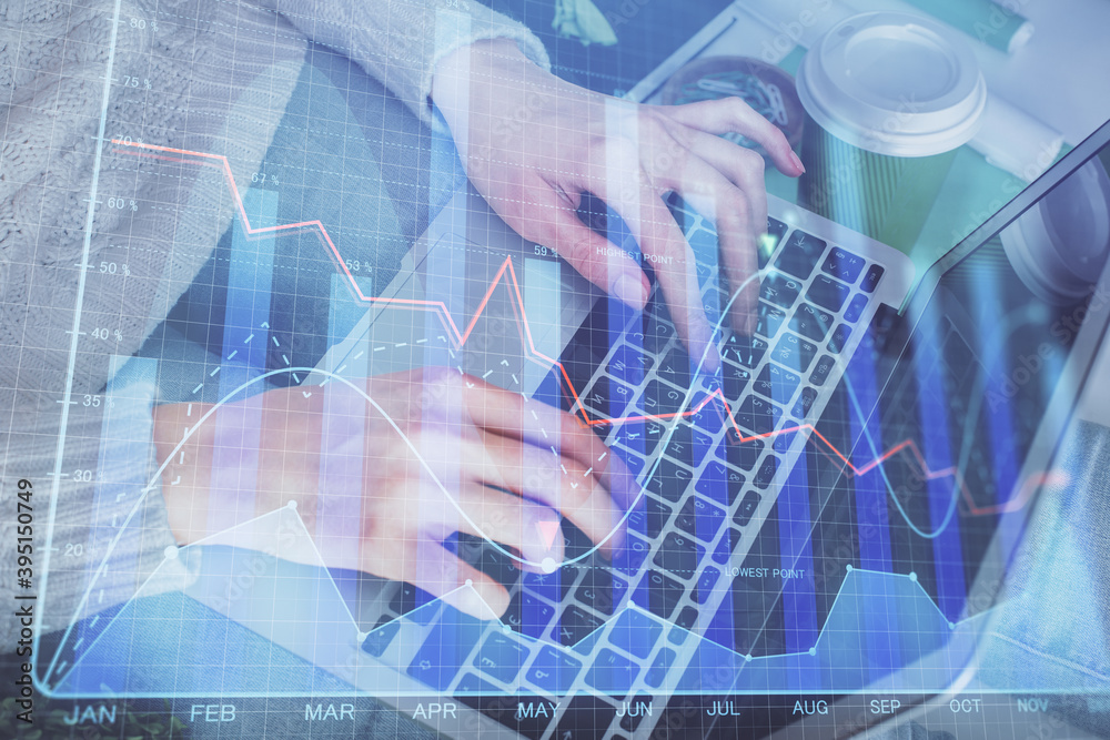 Double exposure of woman hands typing on computer and forex chart hologram drawing. Stock market invest concept. Double exposure of woman hands typing on computer and forex chart hologram drawing. Stock market invest concept.