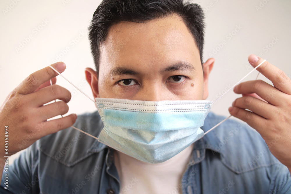 Asian man wearing medical mask coughing hard, covid-19 coronavirus patient, new normal Asian man wearing medical mask coughing hard, covid-19 coronavirus patient, new normal